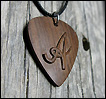 Plectrum, with a letter